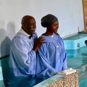 A new member baptized with a joyful smile
