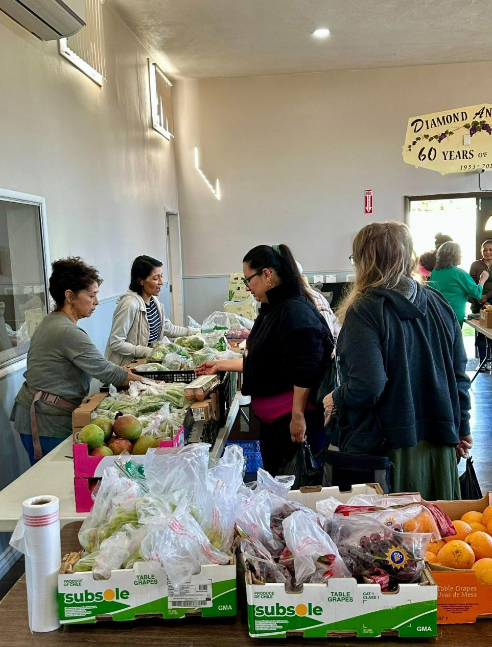 Volunteers handing out fresh produce